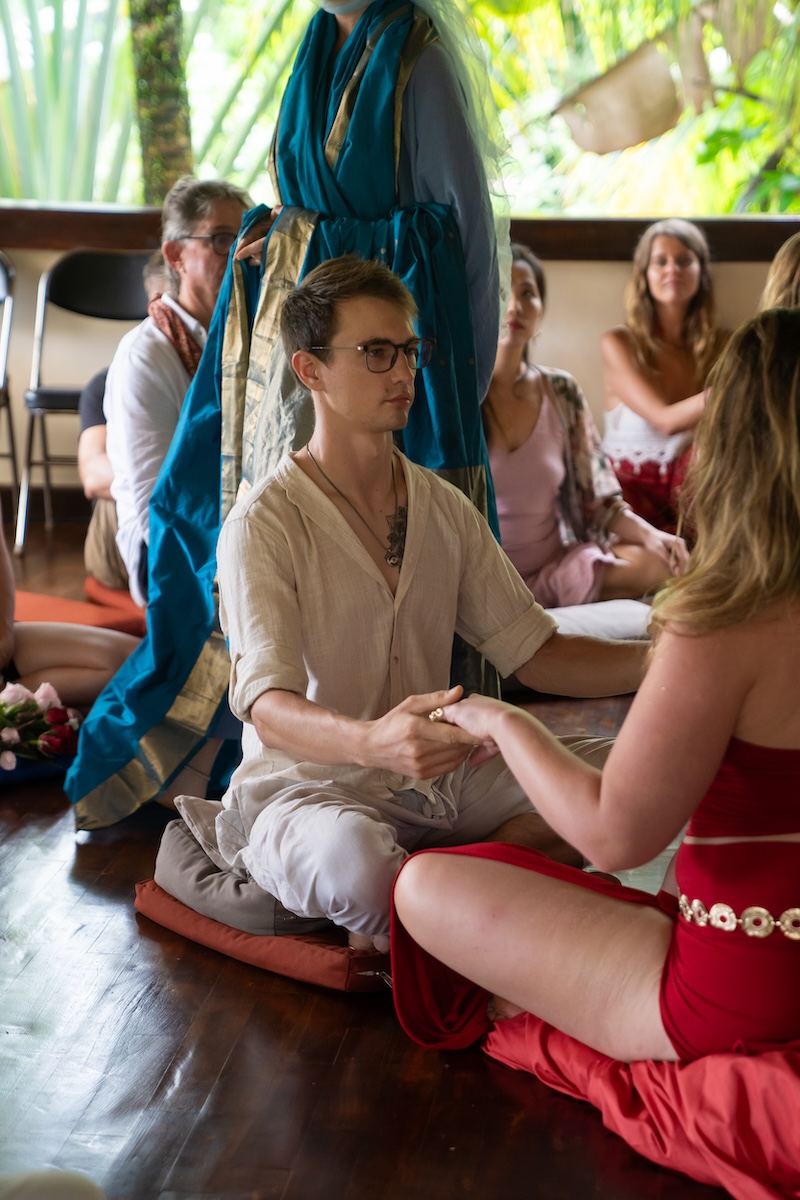 Two people sitting together in conversation at Samyama