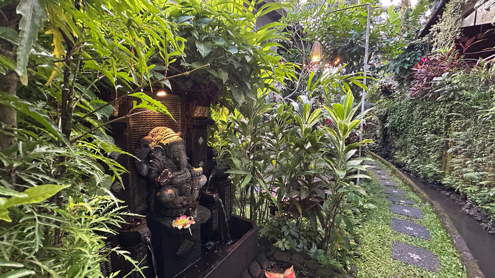 Ganesha shrine surrounded by tropical greenery at Samyama