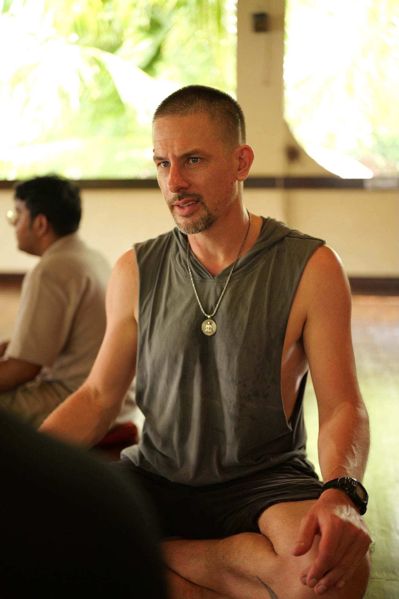 A man in quiet reflection during a seated practice